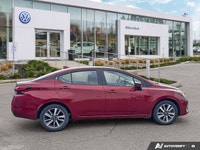 Designed for efficiency and confident urban navigation, this vibrant red 2024 Nissan Versa SV, is yo... (image 4)
