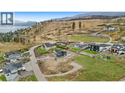 Perched above the shimmering waters of Okanagan Lake, this 0.34-acre lot in the highly desired Trade...