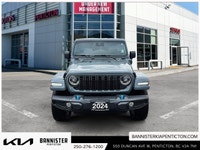 Step into adventure with the 2024 Jeep Wrangler 4xe Sport S, a versatile SUV in a stunning silver fi... (image 1)