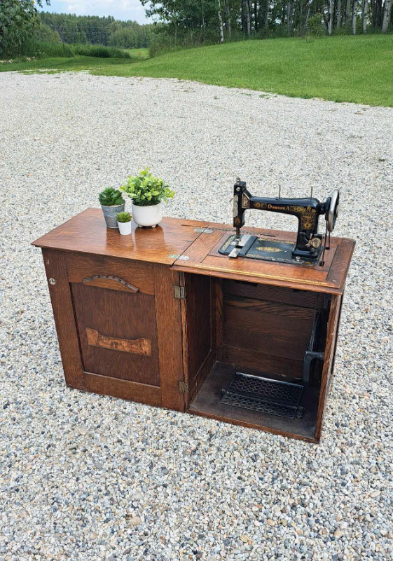 Antique Treadle Sewing Machine in Cabinet in Home Décor & Accents in St. Albert