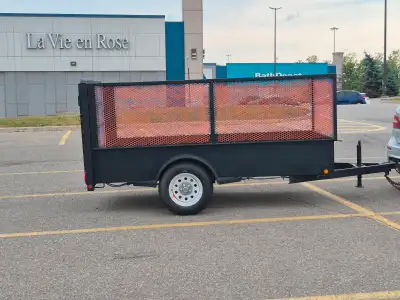5x10 . 3500lbs utility trailer. Decks size 62 inches x 122 inches. 4 feet sides. Made by trailer com...