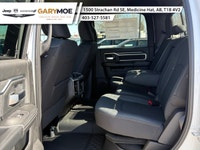 Introducing the 2026 Ram 2500 Big Horn 4x4 Crew Cab with a 64 Box in a vibrant white exterior paired... (image 7)