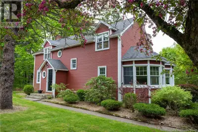 Tucked away in the heart of Old Rothesay, this enchanting home welcomes you with a tree-lined drivew...
