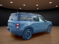 The 2021 Ford Bronco Sport Outer Banks in a striking blue finish with its capable 4x4 drivetrain off... (image 5)