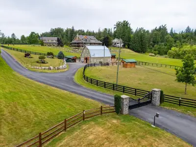 This masterfully planned 20-ac estate designed for MULTI-FAMILY LIVING, equestrian enthusiasts & agr...