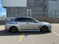 This 2014 Mitsubishi Lancer Evolution delivers pure performance with its turbocharged 2.0L engine, a... (image 3)