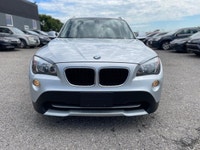 2012 BMW X1 has Clean Carfax, Air Conditioning, Cruise Control, Power Seats, Heated Seats, Sunroof /... (image 1)