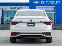 The 2024 Volkswagen Jetta Comfortline stands out in a refined White finish that complements its slee... (image 6)