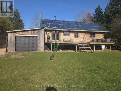 This charming detached Bungaloft log house sits on 1.44 acres. Features 6 bedrooms. 3 Main floor, 1...