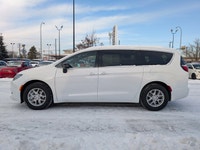 The 2026 Chrysler Grand Caravan SXT in Bright White with a Black interior offers a perfect balance o... (image 2)