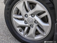 Discover the 2020 Hyundai Venue Preferred: a sleek, black subcompact SUV designed for urban adventur... (image 8)