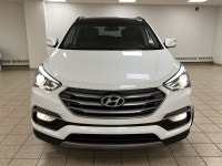 Powerful confidence wrapped in Frost Whitethis 2018 Hyundai Santa Fe 2.4 SE All-Wheel Drive SUV is e... (image 2)