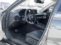 The 2024 Honda Accord Hybrid Touring commands attention in a refined Grey finish that highlights its... (image 7)
