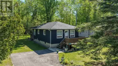 Meticulously maintained and beautifully updated, this 3-bedroom four-season cottage is the perfect W...