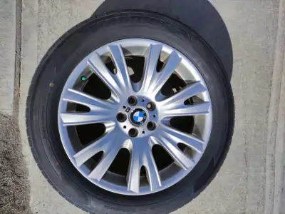 Staggered set of four BMW 223M alloy wheels with winter tires mounted. These were used on a 2013 BMW...