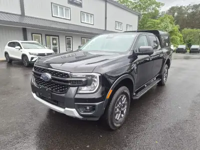 The 2024 Ford Ranger XLT, in a captivating black finish, offers a robust 4×4 drivetrain, ensuring ex...