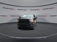 Meet the 2023 RAM 2500 Big Horn 4x4 Crew Cab 6'4 Box with the Night Edition package, offered by Hald... (image 2)