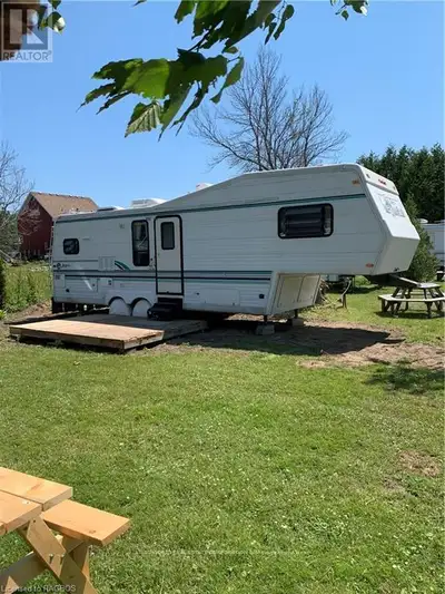 Enjoy this weekly trailer, site and boat launch rentals in Stokes Bay. This spacious RV has a queen...
