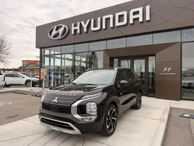 The 2023 Mitsubishi Outlander PHEV LE is a plug-in hybrid SUV that combines fuel efficiency, electri...