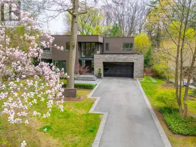 This is not your average home-it's a statement.Set on a premium, near half-acre lot, this custom mas...