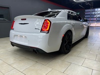The 2023 Chrysler 300, particularly the 300C RWD in pristine white, is a powerful sedan that truly s... (image 4)
