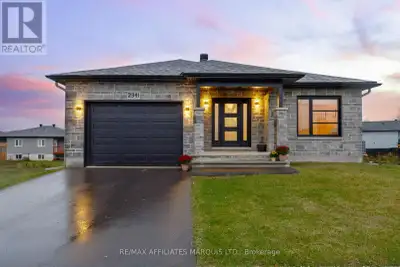 A home with 4 bedrooms, 3 full bathrooms, a walk out basement, a fully fenced rear yard, an attached...