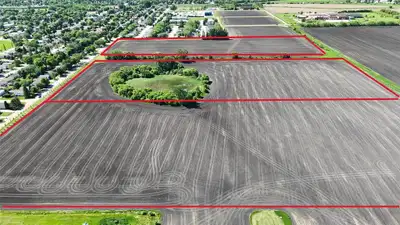 P05//Portage La Prairie/Uncover a rare, high-yield investment with this expansive 7-acre parcel (one...