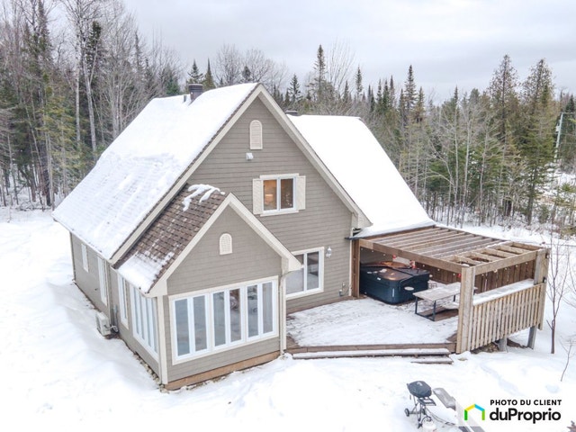 $659,000 - Cottage for sale in St-Côme — photo 1