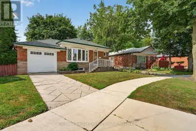 Behind this classic brick bungalow is a home with far more space-and far more potential-than you mig...