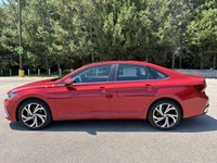 // ACCIDENT FREE!! // // SINGLE OWNER! // Finished in red with a black interior, this 2026 Volkswage... (image 9)