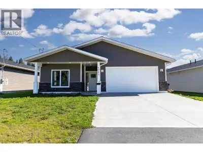 Nearly new and ready for you! This modern rancher with garage features an open floor plan with the 3...