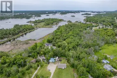 Conveniently Located Country Property Between Espanola & Manitoulin Island! Nestled on 1.14 acres in...
