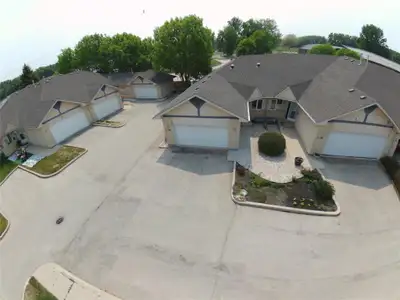 P02//Portage La Prairie/RARE OPPORTUNITY FOR CAREFREE CONDO LIVING WITH LAKE VIEWS!Enjoy a low-maint...