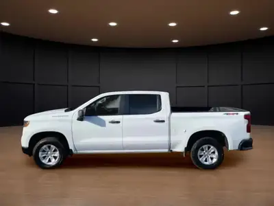 The 2023 Chevrolet Silverado 1500 Crew Cab Short Box 4-Wheel Drive Work Truck, in crisp white with a...