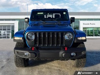 Conquer every landscape in this 2023 Jeep Gladiator Rubicon, gleaming in Hydro Blue Pearl. With only... (image 7)