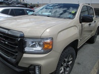 Finished in Desert Sand Metallic with a Black interior, this 2022 GMC Canyon 4wd At4 Cloth brings mi... (image 1)