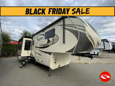 Grand Design Solitude 310GK fifth wheel highlights: Rear Tri-Fold Sofa Kitchen Island Four Door Refr...