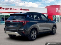 Navigate urban streets and weekend adventures effortlessly in this well-equipped 2024 Kia Seltos EX.... (image 5)