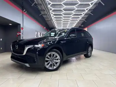 The 2025 Mazda CX-90 MHEV GT in black with AWD offers remarkable handling for those who value both p...
