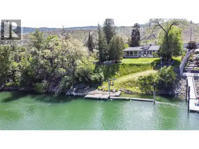 Over 100’ of South Thompson River frontage with a private dock, private beach, and unobstructed suns...