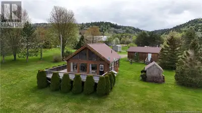 Welcome to 29 Log Cabin Lane! This charming chalet-style home offers 57 feet of water frontage on th...
