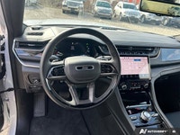 2.0L I4 DOHC, 4WD. Odometer is 13302 kilometers below market average! Bright White Clearcoat 2023 Je... (image 9)