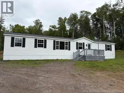 This 1999 16x64 3 bedroom mini home sits on a private 1.6 acres framed in by the trees in the back....