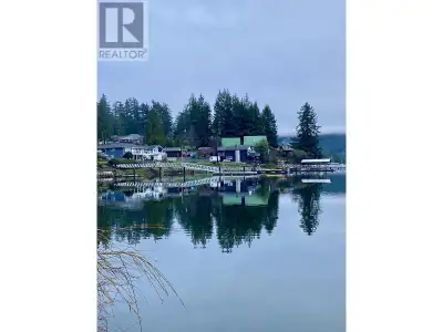 Boater's Alert: Rare 3.07-acre oceanfront property with a 120-foot licensed dock and a 40' L x 12' W...