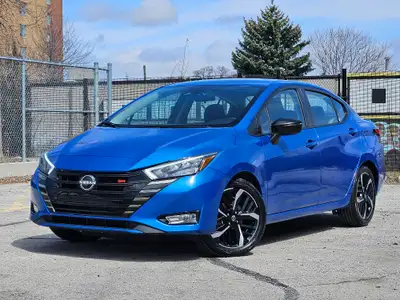 Buckle up, because this 2023 Nissan Versa SR CVT in Electric Blue Metallic isnt just a carits your t...