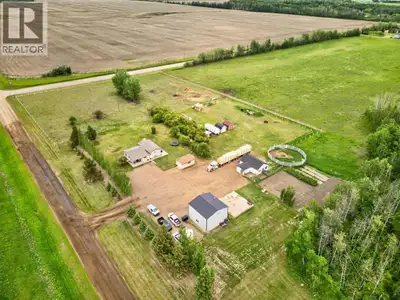Enjoy country living on this 8-acre property featuring a 1,295 sq. ft. bungalow with 4 bedrooms and...