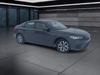 The 2024 Honda Civic Sedan LX-B CVT in sophisticated gray combines front-wheel drive with precise ha... (image 1)