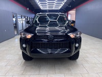 Experience the rugged elegance of the 2016 Toyota 4Runner SR5, presented in a commanding Black finis... (image 6)