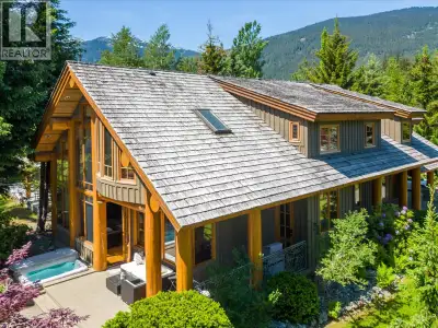 By the Nicklaus North Golf Course, you can find this beautiful 5-bedroom house. Huge log beams and s...