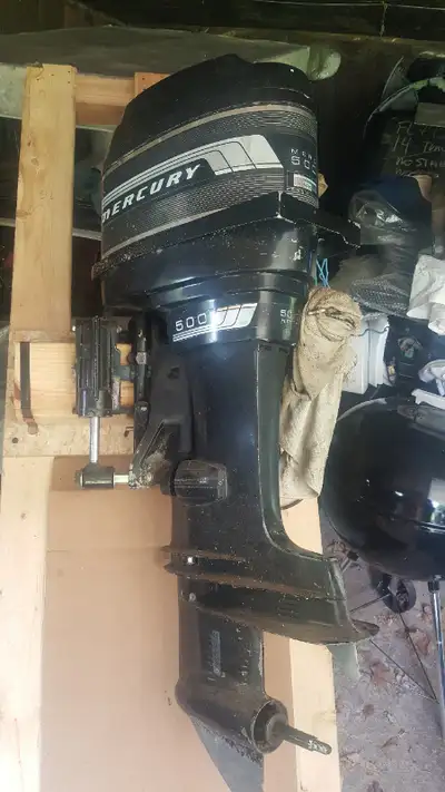 50 hp Mercury 2 stroke, 20 inch shaft, with control and power trim. Motor was in store over 15 years...